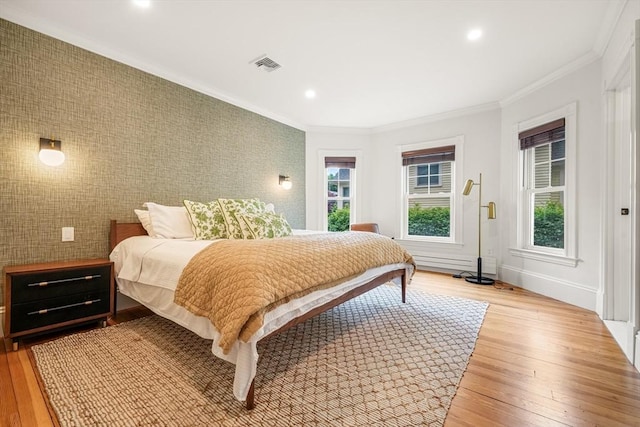 97 Manet Rd, Newton, MA 02467 - bedroom with multiple windows, an accent wall, light wood-style floors, ornamental molding, and recessed lighting