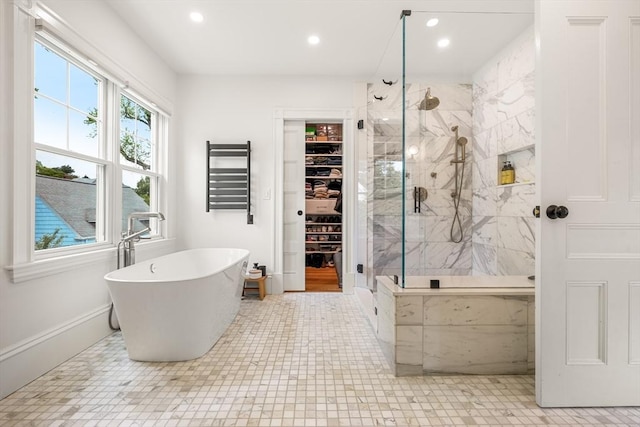 97 Manet Rd, Newton, MA 02467 - bathroom featuring a freestanding tub, a marble finish shower, recessed lighting, a walk in closet, and baseboards
