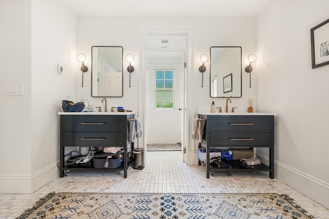 97 Manet Rd, Newton, MA 02467 - full bathroom with two vanities, tile patterned flooring, and baseboards