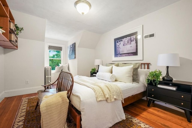 97 Manet Rd, Newton, MA 02467 - bedroom featuring radiator, hardwood / wood-style flooring, baseboards, and vaulted ceiling