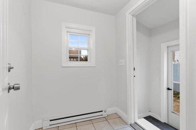 interior space with a baseboard radiator and light tile patterned floors