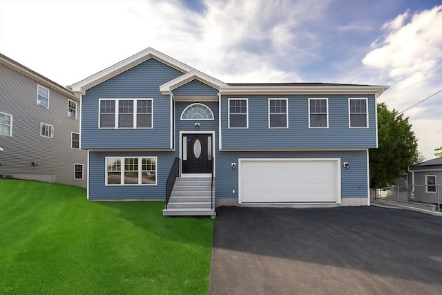 21 Seattle St, Worcester, MA 01604 - raised ranch with an attached garage, driveway, and a front lawn