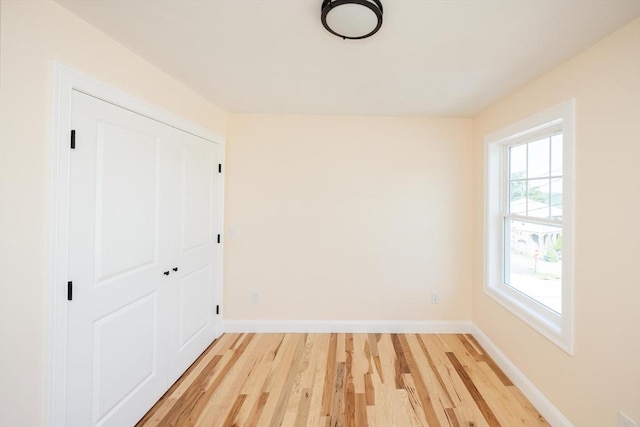 21 Seattle St, Worcester, MA 01604 - unfurnished bedroom with light wood-type flooring and a closet