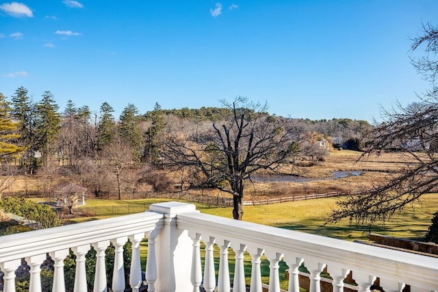 view of yard with a balcony