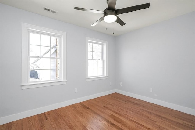 117 Montvale Ave, Woburn, MA 01801 - spare room featuring baseboards, wood finished floors, and a ceiling fan