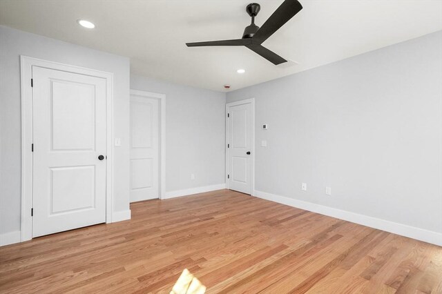 117 Montvale Ave, Woburn, MA 01801 - unfurnished bedroom featuring light wood-type flooring, baseboards, recessed lighting, and a ceiling fan
