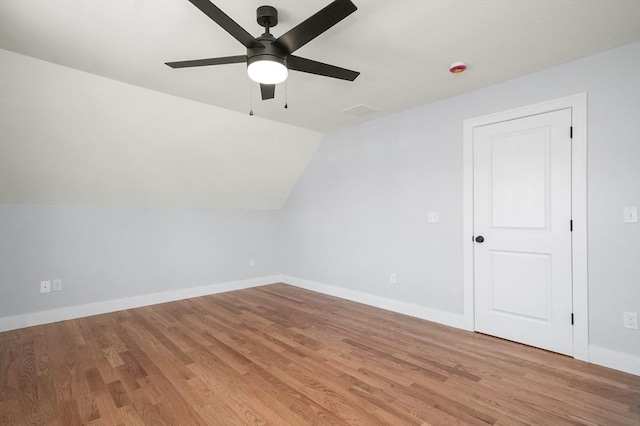 117 Montvale Ave, Woburn, MA 01801 - additional living space with a ceiling fan, light wood finished floors, baseboards, and vaulted ceiling
