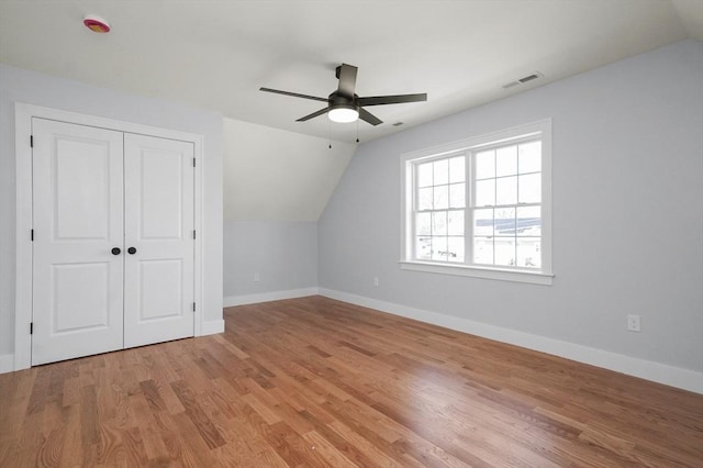 117 Montvale Ave, Woburn, MA 01801 - bonus room featuring vaulted ceiling, ceiling fan, baseboards, and light wood-style floors