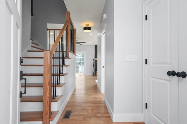 117 Montvale Ave, Woburn, MA 01801 - corridor with baseboards, light wood-style flooring, stairs, and recessed lighting