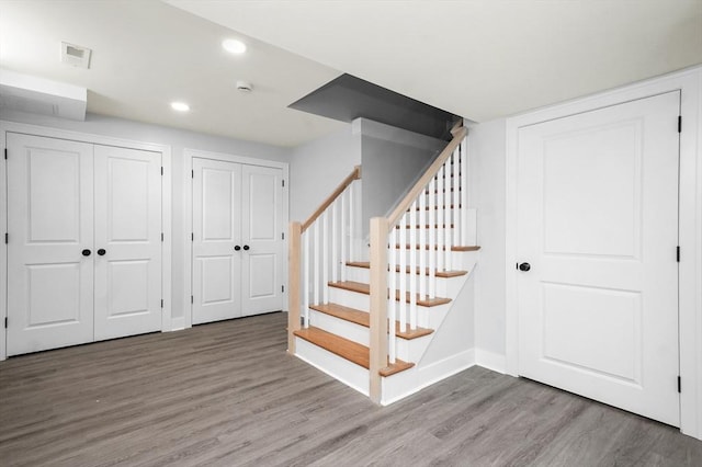 117 Montvale Ave, Woburn, MA 01801 - below grade area featuring wood finished floors, baseboards, recessed lighting, and stairs