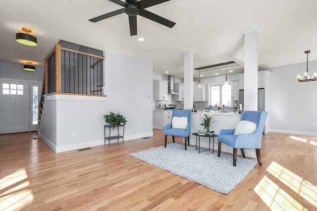 117 Montvale Ave, Woburn, MA 01801 - sitting room featuring a ceiling fan, a chandelier, light wood finished floors, baseboards, and recessed lighting