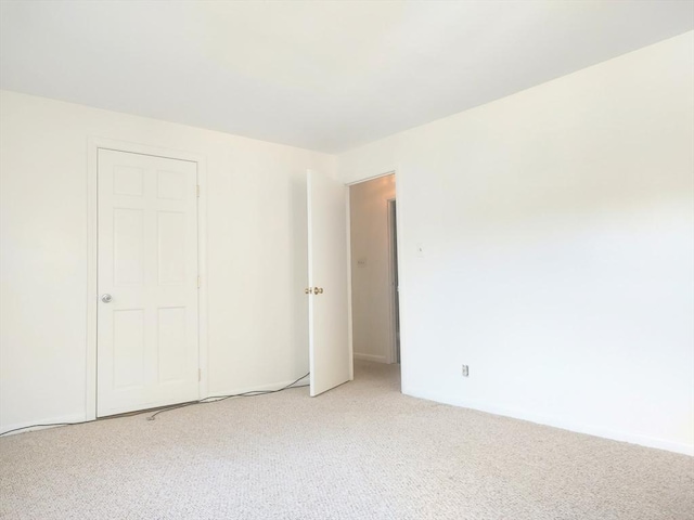 empty room featuring light colored carpet
