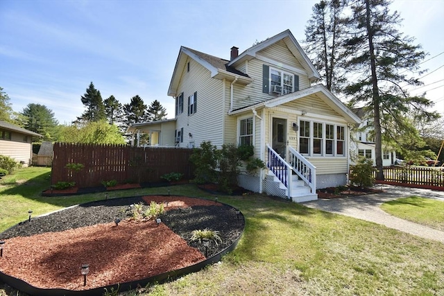 traditional-style home featuring entry steps and a chimney