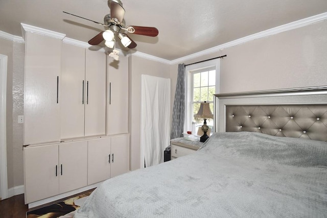 bedroom with crown molding, ceiling fan, and baseboards