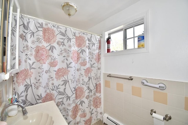full bathroom featuring a sink, tile walls, and a shower with shower curtain
