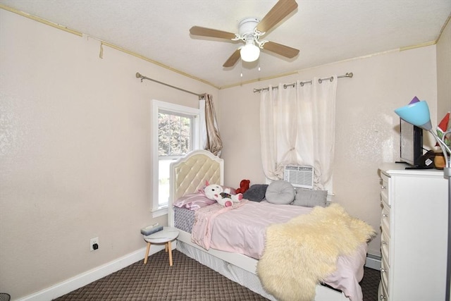carpeted bedroom with cooling unit, baseboards, and ceiling fan
