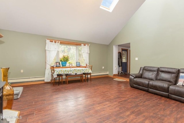 living room with a baseboard heating unit, dark wood-type flooring, a skylight, and high vaulted ceiling