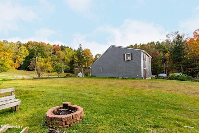 view of yard featuring an outdoor fire pit