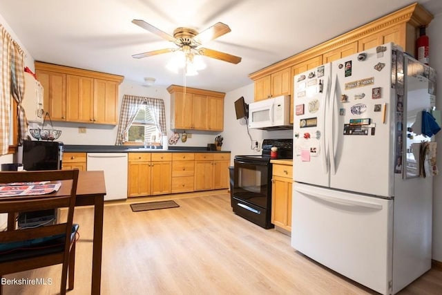 kitchen with ceiling fan, light wood-type flooring, and white appliances