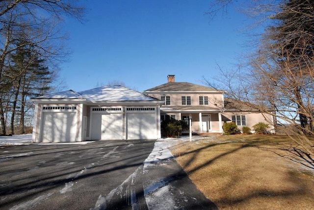 view of front of house with a porch and a garage