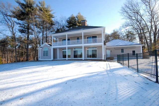 rear view of house with a balcony