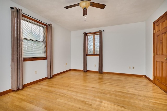 unfurnished room featuring ceiling fan and light hardwood / wood-style flooring