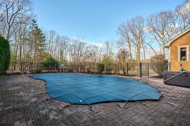 view of swimming pool with a patio area