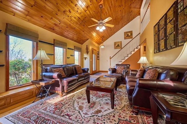 living room featuring hardwood / wood-style flooring, high vaulted ceiling, ceiling fan, and wood ceiling