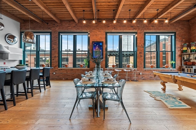 dining space featuring light hardwood / wood-style floors, billiards, and wooden ceiling