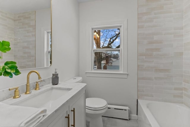 full bathroom with tile patterned floors, toilet, vanity, a bathtub, and baseboard heating