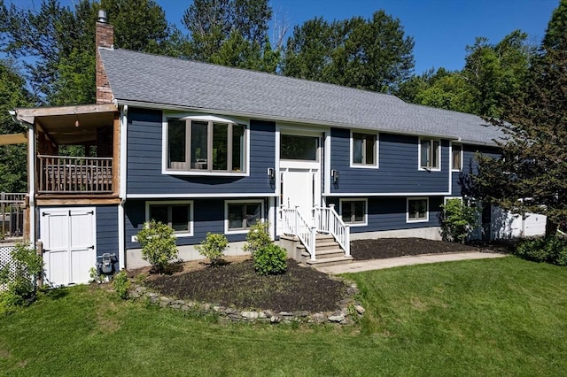 10 Longmeadow Ln, Medway, MA 02053 - raised ranch with a chimney, a front yard, a shingled roof, and a balcony