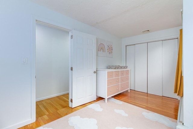 10 Longmeadow Ln, Medway, MA 02053 - bedroom featuring wood finished floors and a closet