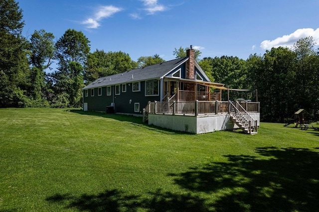10 Longmeadow Ln, Medway, MA 02053 - rear view of house with a wooden deck, a yard, stairs, and a chimney