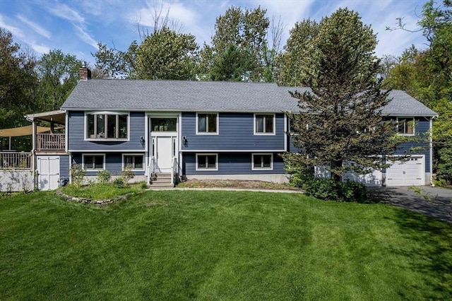 10 Longmeadow Ln, Medway, MA 02053 - bi-level home featuring a chimney, a front yard, a garage, entry steps, and asphalt driveway