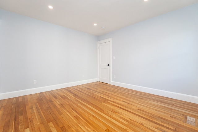 spare room with light wood-type flooring