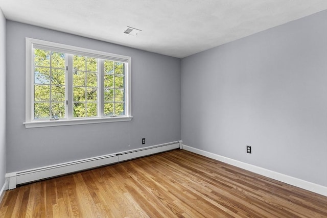 35 Crest Rd, Framingham, MA 01702 - empty room with baseboard heating, wood finished floors, and baseboards