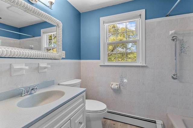35 Crest Rd, Framingham, MA 01702 - bathroom with a baseboard heating unit, tile walls, toilet, vanity, and  shower combination