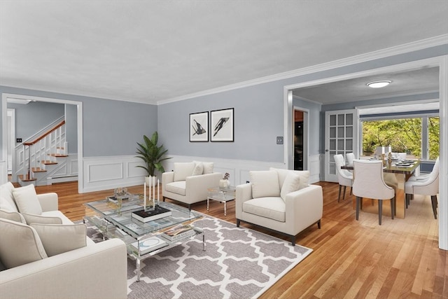 35 Crest Rd, Framingham, MA 01702 - living area featuring stairway, light wood finished floors, ornamental molding, and a wainscoted wall