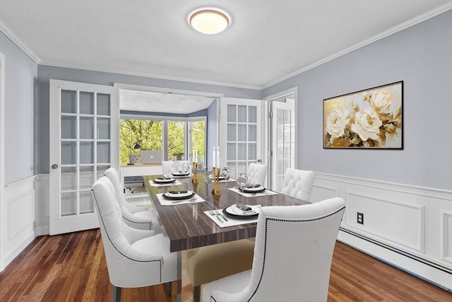 35 Crest Rd, Framingham, MA 01702 - dining room with baseboard heating, a wainscoted wall, ornamental molding, and dark wood-style floors