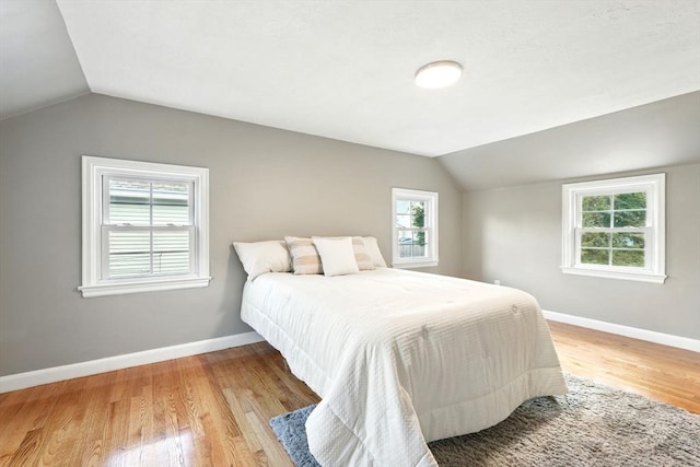 132 Nelson St, West Springfield, MA 01089 - bedroom with vaulted ceiling, light wood finished floors, and multiple windows
