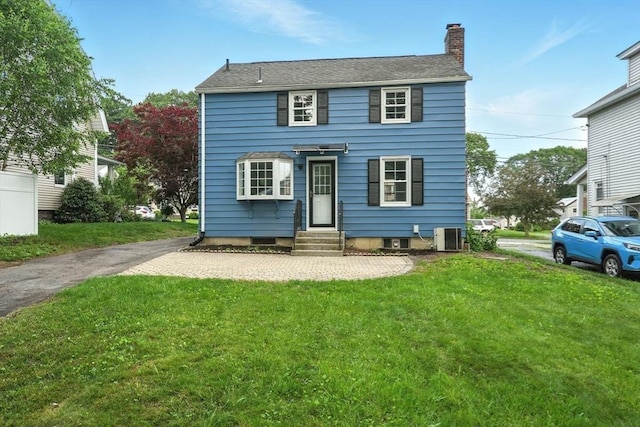 132 Nelson St, West Springfield, MA 01089 - back of house featuring entry steps, a chimney, and a lawn