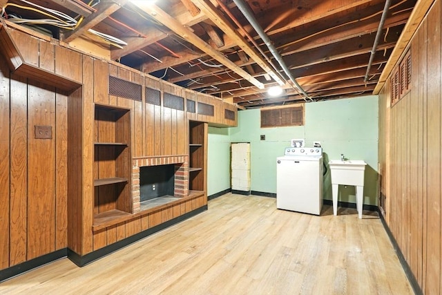 132 Nelson St, West Springfield, MA 01089 - unfinished below grade area with washer / clothes dryer, wood walls, and light wood finished floors