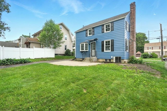132 Nelson St, West Springfield, MA 01089 - back of property featuring entry steps, a chimney, and a patio