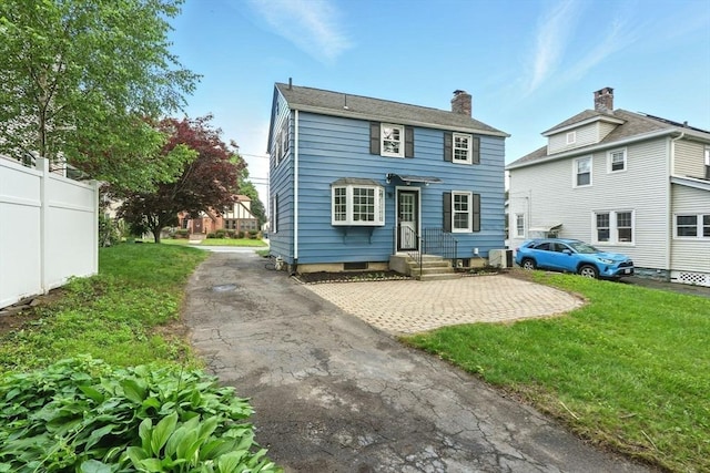 132 Nelson St, West Springfield, MA 01089 - rear view of house featuring a chimney