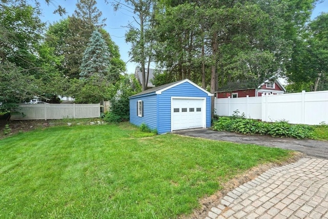 132 Nelson St, West Springfield, MA 01089 - view of yard with driveway, an outbuilding, and a garage