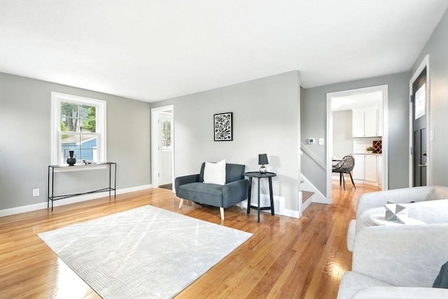 132 Nelson St, West Springfield, MA 01089 - living room with stairway and light wood-style flooring