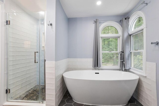 649 Robin Hill St, Marlborough, MA 01752 - full bath featuring tile walls, a freestanding bath, a stall shower, a wainscoted wall, and recessed lighting