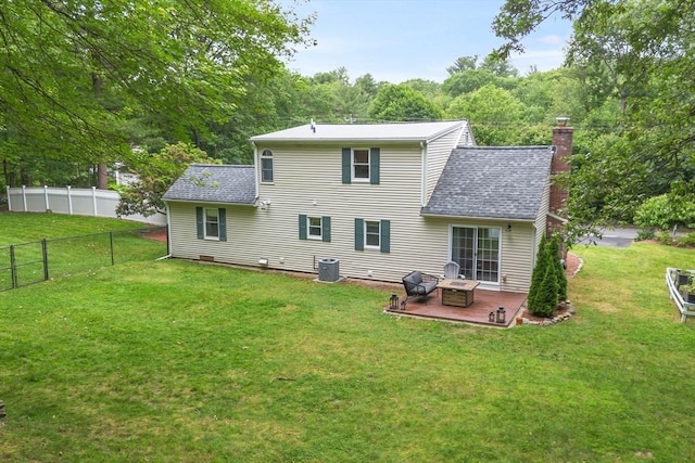 649 Robin Hill St, Marlborough, MA 01752 - back of property featuring a shingled roof, a fenced backyard, a chimney, and a patio area