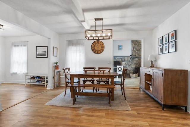 649 Robin Hill St, Marlborough, MA 01752 - dining area featuring light wood-style floors, plenty of natural light, and a chandelier