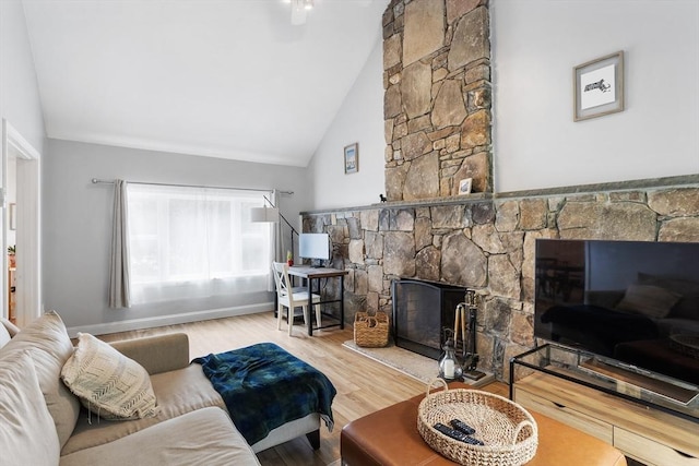 649 Robin Hill St, Marlborough, MA 01752 - living room with a stone fireplace, wood finished floors, and high vaulted ceiling